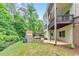The backyard features a stone fireplace, patio and outdoor furniture at 1575 Petal Nw Pt, Kennesaw, GA 30152