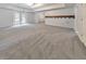 Large basement featuring carpet, recessed lights, and exterior access through double doors at 1575 Petal Nw Pt, Kennesaw, GA 30152