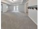 Spacious basement with carpet flooring, recessed lighting, and a door leading to the exterior at 1575 Petal Nw Pt, Kennesaw, GA 30152