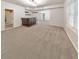 Basement with carpet, bar area with dark wood bar, and plenty of open space at 1575 Petal Nw Pt, Kennesaw, GA 30152