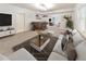 Finished basement featuring a bar area, an open living space with a couch, and neutral carpeting at 1575 Petal Nw Pt, Kennesaw, GA 30152