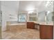 Bathroom features tile floors, soaking tub, dual vanities and lots of counter space at 1575 Petal Nw Pt, Kennesaw, GA 30152