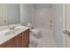 Bathroom featuring a vanity with sink and cabinet storage, toilet, and tiled shower/tub combo at 1575 Petal Nw Pt, Kennesaw, GA 30152