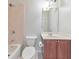 Bright bathroom featuring a bathtub with shower, and a vanity with a sink and storage at 1575 Petal Nw Pt, Kennesaw, GA 30152