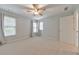 Bright and airy bedroom with ample natural light, neutral walls and carpet at 1575 Petal Nw Pt, Kennesaw, GA 30152