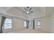 Bedroom features a trey ceiling with fan, two large windows, and access to a porch at 1575 Petal Nw Pt, Kennesaw, GA 30152