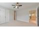 Bedroom featuring a ceiling fan, closet, and a view of the second floor landing at 1575 Petal Nw Pt, Kennesaw, GA 30152