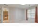 Bright bedroom with large window, neutral carpet and stylish curtains at 1575 Petal Nw Pt, Kennesaw, GA 30152