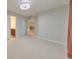 Light-filled bedroom features neutral walls and carpet, enhanced by a contemporary ceiling fan at 1575 Petal Nw Pt, Kennesaw, GA 30152