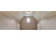 Large walk-in closet features an oval window and wire shelving on either side at 1575 Petal Nw Pt, Kennesaw, GA 30152