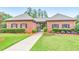 Charming brick clubhouse with well-kept landscaping and inviting entrance at 1575 Petal Nw Pt, Kennesaw, GA 30152