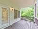 Relaxing outdoor patio area with a wooden deck and natural scenery at 1575 Petal Nw Pt, Kennesaw, GA 30152