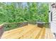 The spacious wooden deck features a grill and provides an area for relaxing and entertaining at 1575 Petal Nw Pt, Kennesaw, GA 30152