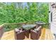 Inviting deck area with a grill and dining table, perfect for outdoor entertainment at 1575 Petal Nw Pt, Kennesaw, GA 30152