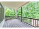 An outdoor patio with a covered wooden deck, offering shelter from the elements at 1575 Petal Nw Pt, Kennesaw, GA 30152