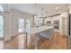 Modern kitchen features a large center island, stainless steel appliances, and ample cabinet space at 1575 Petal Nw Pt, Kennesaw, GA 30152