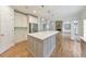 Well-appointed kitchen featuring a large island and white cabinetry at 1575 Petal Nw Pt, Kennesaw, GA 30152