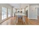 Open concept kitchen with white cabinetry, stainless steel appliances, and large island at 1575 Petal Nw Pt, Kennesaw, GA 30152