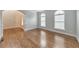 Bright living area with hardwood floors, neutral walls, and many bright windows at 1575 Petal Nw Pt, Kennesaw, GA 30152