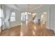 Open living space with hardwood floors, wainscoting, and a staircase at 1575 Petal Nw Pt, Kennesaw, GA 30152