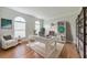 Bright office with hardwood floors, white desk, and built-in shelving at 1575 Petal Nw Pt, Kennesaw, GA 30152