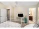 Bedroom leading to bathroom with carpet flooring, a bed, sitting area and decorative accents at 2555 Flat Shoals Rd # 1405, Atlanta, GA 30349