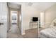 Bedroom showing neutral walls, carpet, a bed, and a glass desk at 2555 Flat Shoals Rd # 1405, Atlanta, GA 30349