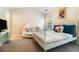 Bright bedroom featuring carpet flooring, a bed, sitting area and decorative accents at 2555 Flat Shoals Rd # 1405, Atlanta, GA 30349