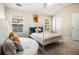 Bedroom with natural light, neutral walls, carpet flooring, a bed, and unique seating at 2555 Flat Shoals Rd # 1405, Atlanta, GA 30349