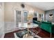 Bright dining area with a modern table set, hardwood floors, and natural light creating a perfect space for meals at 2555 Flat Shoals Rd # 1405, Atlanta, GA 30349