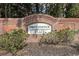 Brick entrance sign for Providence Place community, surrounded by greenery and well-maintained landscaping at 2555 Flat Shoals Rd # 1405, Atlanta, GA 30349
