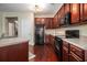 Well-equipped kitchen featuring stainless steel appliances, ample cabinet space, and hardwood floors at 2555 Flat Shoals Rd # 1405, Atlanta, GA 30349