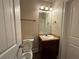 Clean bathroom features a vanity with a sink, toilet, and vanity lighting at 381 Plymstock Dr, Mcdonough, GA 30253