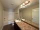 Bathroom with single sink vanity and a shower-tub combo at 381 Plymstock Dr, Mcdonough, GA 30253