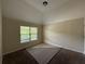 Bright bedroom with natural light, neutral walls, and plush carpeting at 381 Plymstock Dr, Mcdonough, GA 30253