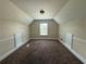 Cozy bedroom featuring a vaulted ceiling, chair rail trim, and plush carpeting at 381 Plymstock Dr, Mcdonough, GA 30253