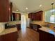 Well-equipped kitchen with stainless steel appliances, granite countertops, and ample cabinet space at 381 Plymstock Dr, Mcdonough, GA 30253
