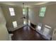 Bright living room featuring a fireplace, ceiling fan, and lots of windows at 381 Plymstock Dr, Mcdonough, GA 30253