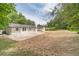 Expansive backyard with patio and lush green surroundings, perfect for outdoor enjoyment at 703 Alvis Ln, Norcross, GA 30093