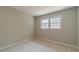 Bright bedroom with neutral walls and a double-paned window at 703 Alvis Ln, Norcross, GA 30093
