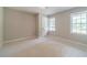 Neutral bedroom with carpet, windows and natural light at 703 Alvis Ln, Norcross, GA 30093