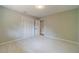 Neutral bedroom featuring a closet with bi-fold doors and adjacent doorway at 703 Alvis Ln, Norcross, GA 30093