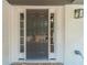 Elegant front door with sidelights, painted in a stylish dark gray with white trim at 703 Alvis Ln, Norcross, GA 30093