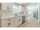 Bright kitchen with stainless steel dishwasher and modern hardware at 703 Alvis Ln, Norcross, GA 30093