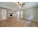 Bright living room with fireplace, neutral walls, and modern laminate flooring at 703 Alvis Ln, Norcross, GA 30093
