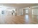 Open-concept space with a white kitchen, spacious living area, and modern finishes at 703 Alvis Ln, Norcross, GA 30093