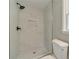 Walk-in shower with rain shower head and updated fixtures at 703 Alvis Ln, Norcross, GA 30093