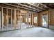 Spacious unfinished basement with framing, exposed ceiling, and a door to the backyard at 1300 Winfair Ne Ln, Brookhaven, GA 30329
