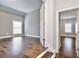 Welcoming view into a bedroom with hardwood floors and access to another room at 1300 Winfair Ne Ln, Brookhaven, GA 30329