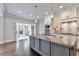 Gourmet kitchen boasts a granite island, stainless steel appliances, and seamless flow to a covered patio at 1300 Winfair Ne Ln, Brookhaven, GA 30329
